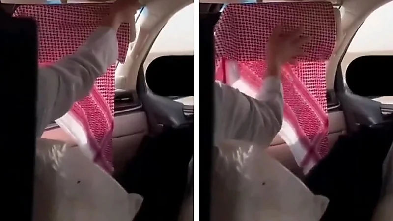 رجل يستخدم الشماغ لحماية زوجته من أشعة الشمس ..فيديو