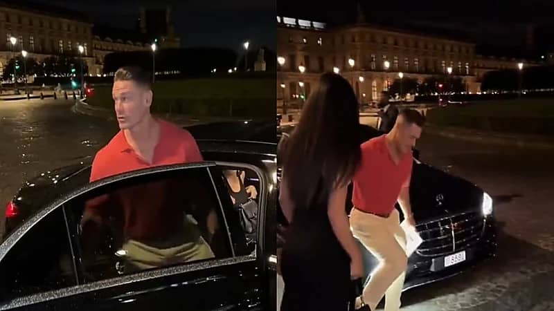 جون سينا يرفع زوجته بيد واحدة لكي تتجنب بركة مياه بالطريق.. فيديو