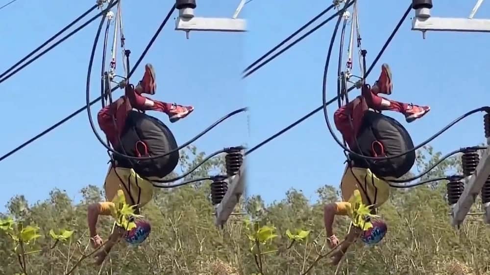 لحظات تحبس الأنفاس لشاب سقط من مظلته الشراعية على عمود كهربائي ..فيديو