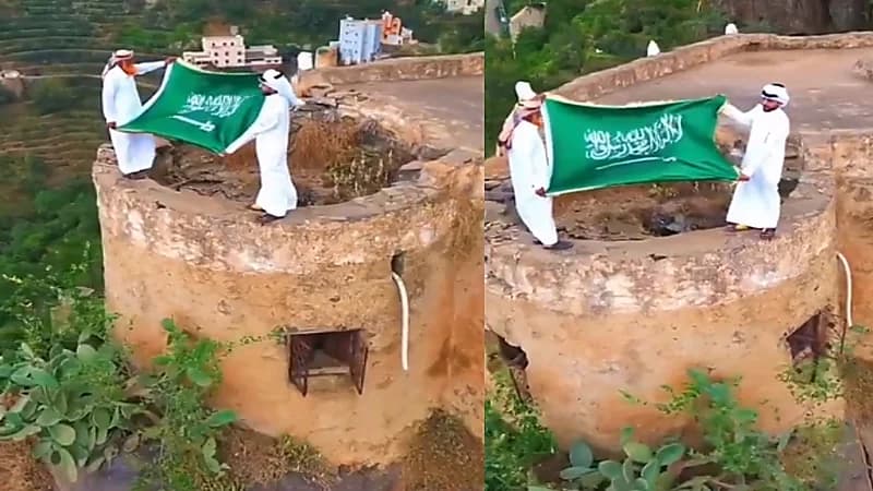 فيديو..مواطنان يحتفلان بيوم العلم على علو شاهق